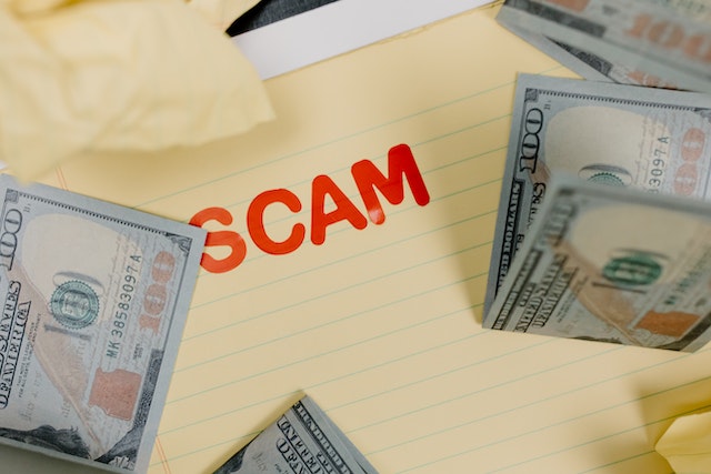 the%20word%20scam%20in%20red%20letters%20surrounded%20by%20cash